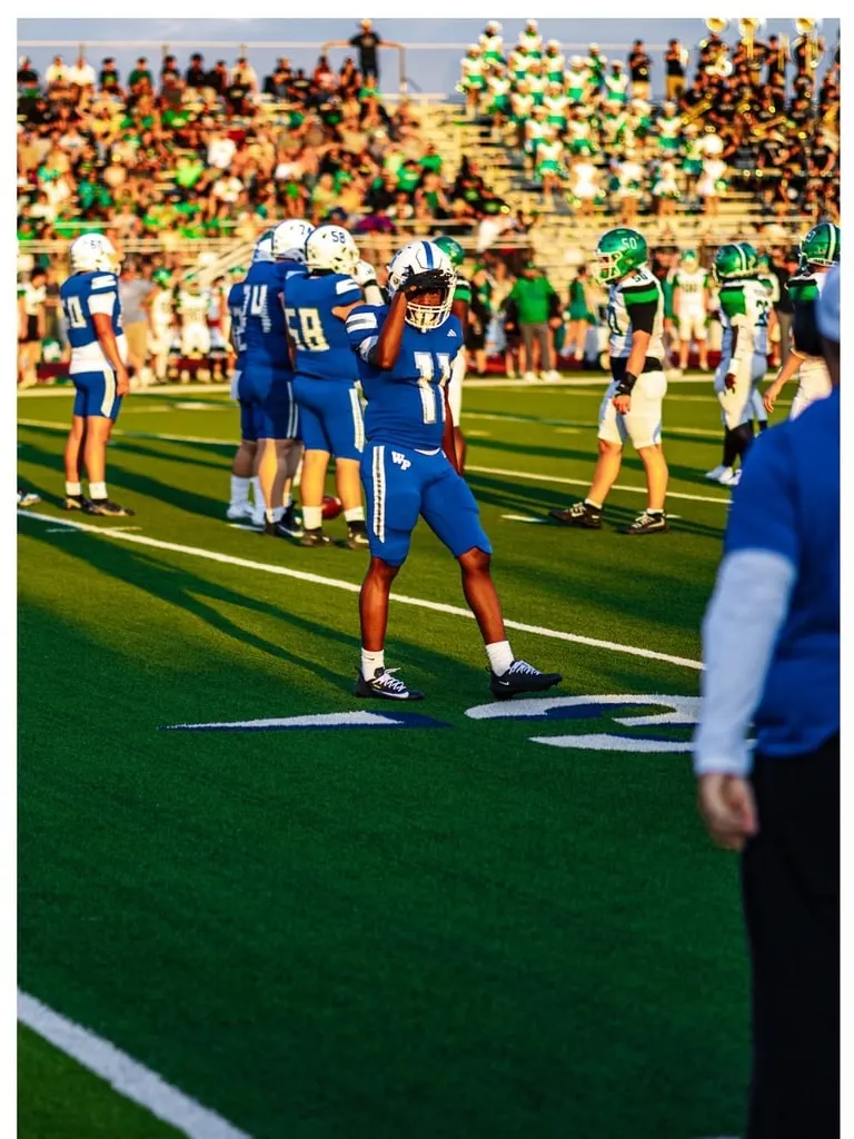 Wills Point Tigers number 11 walking the sideline before the Caddo Mills game